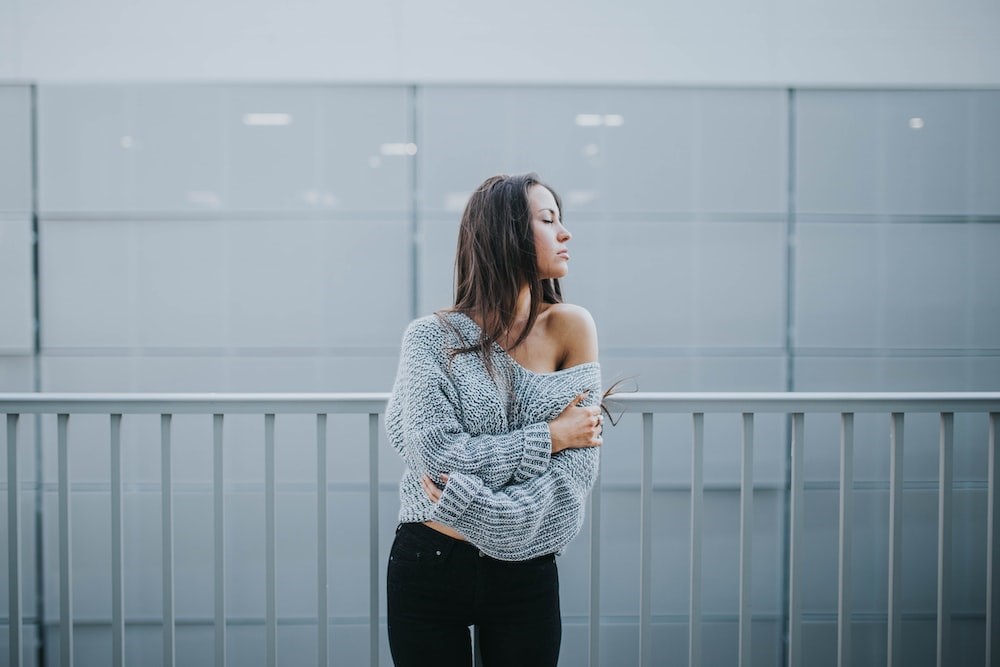 Woman in a gray-tone sweater