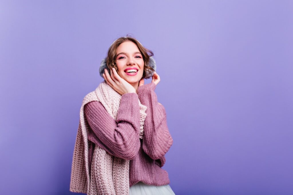 Woman wearing a pastel sweater